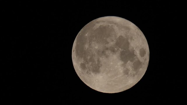 The pink full Moon as seen from Hertford Heath, UK.