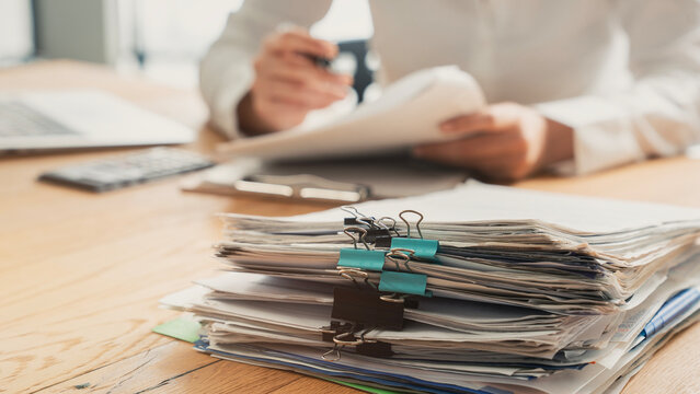Business person working laptop and documents	