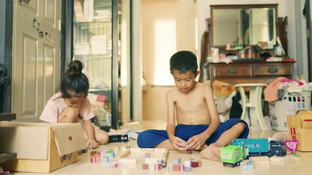 Kids boy and girl enjoy play toy in cozy room enjoy together kids education learnning