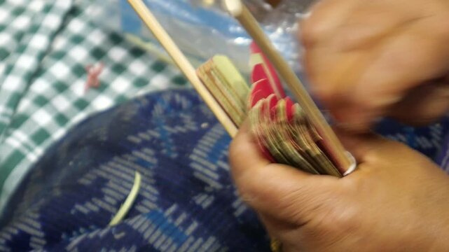 Asian intricate handcraft of making hand fan 