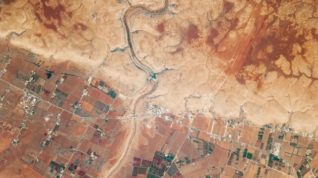 Top shot on wadi in desert. Camera is moving backward and right. Animation based on image by NASA