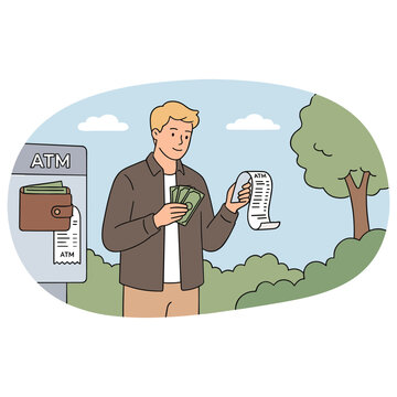 Man withdraws cash from outdoor ATM and checks receipt near tree