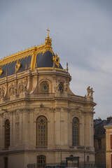 Obraz premium Ornate Gilded Roof and Baroque Architecture at Palace of Versailles, France