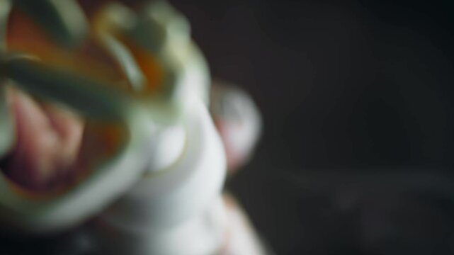 Spreading creamy mayonnaise from a pastry bag on glass, bottom-up view