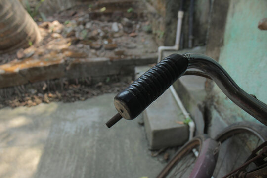 Close up of rubber grip on the handle of a rural power tiller machine