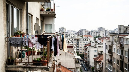 Fototapeta premium clothes hanging to dry balcony old apartment building urban city lifestyle everyday life residential scene Real life imperfect moments