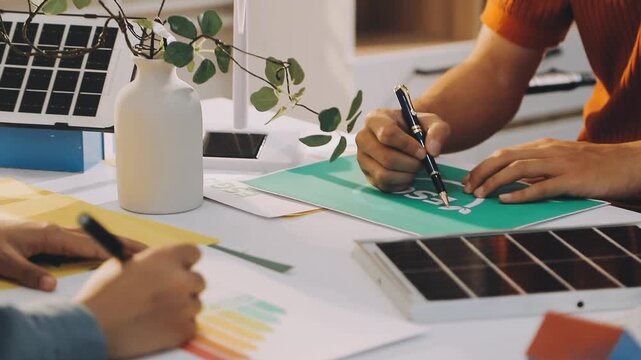 Business executives collaborating on environmental sustainability strategy utilizing renewable energy solutions to achieve net zero targets in corporate meeting.