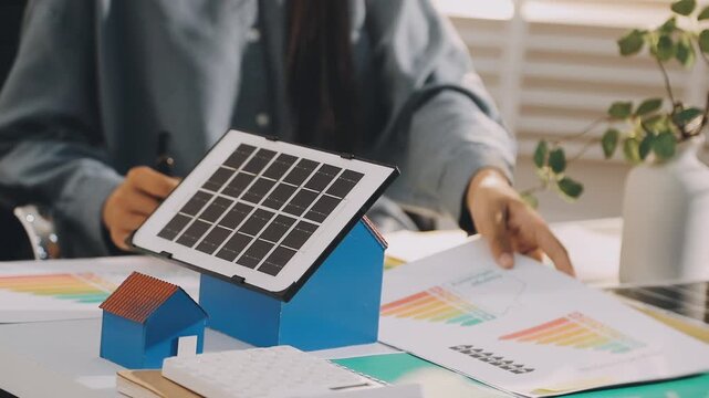 Business executives collaborating on environmental sustainability strategy utilizing renewable energy solutions to achieve net zero targets in corporate meeting.
