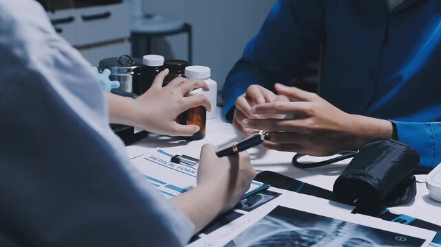 Professional physician working together at hospital, Latino woman doctor discussing with senior doctor for solution to treat patient in workroom.