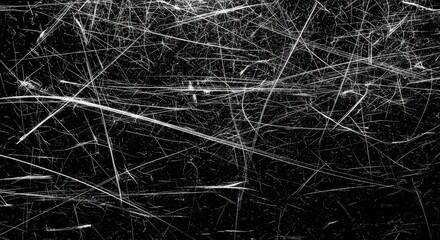 Obraz premium Abstract background of many chaotic white scratches, grunge texture with lines on black surface.
