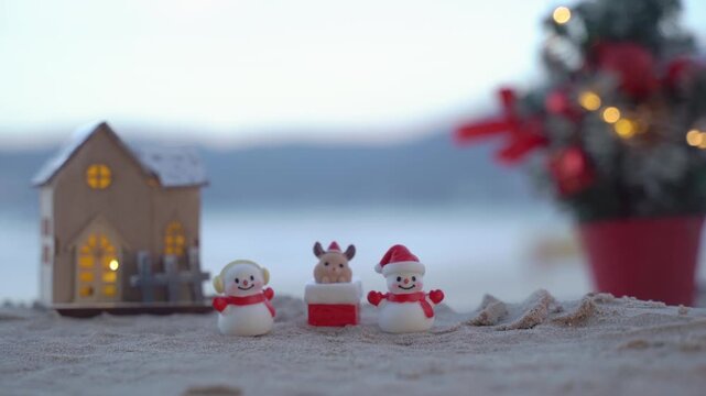 Santa Claus Doll Cute and Christmas Tree House Relaxing on the Beach. Merry Christmas Holiday. Bright Background. Patong Beach, Phuket, Thailand.