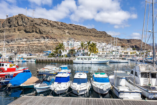 Sailing boats in Puerto de Mogan port harbor on Gran Canaria island on Canary Islands holiday in Spain