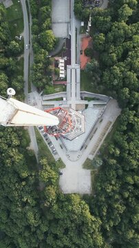Vertical aerial top down descending shot of the triangular Avala tower base, Belgrade, Serbia.