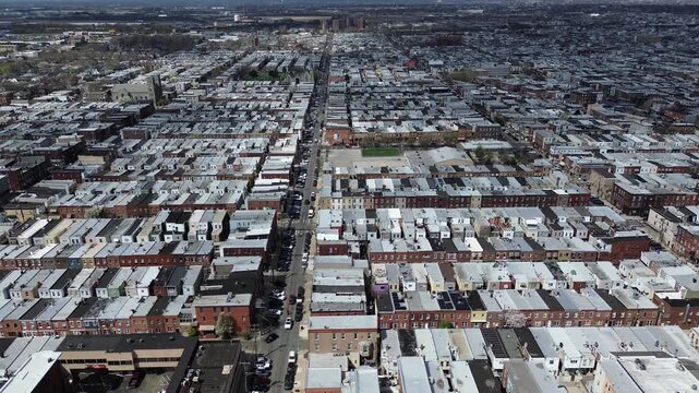 Uniform row pattern around S Hicks St and McKean St reveals tightly aligned homes stretching toward Snyder Ave. Light roof coatings, subtle brick variation, soft haze layered texture Philly, PA