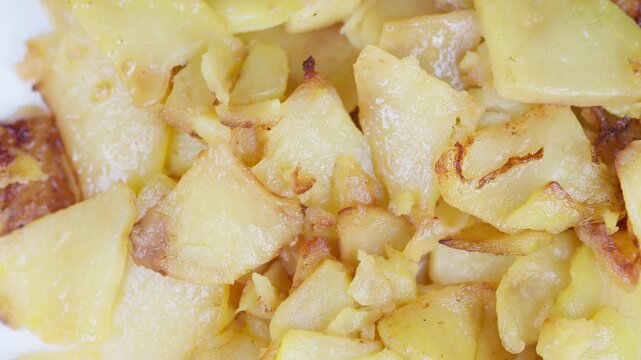 Crispy potato bites. Golden fried potatoes with tender insides. Savory crunchy fried potato morsels boasting crispy outer crust and juicy tender filling throughout