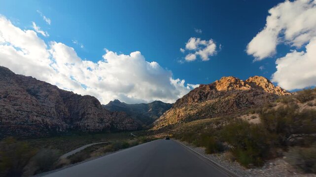 Red Rock Canyon Scenic Drive Loop POV 4K Sunny Day Dramatic Clouds Nevada