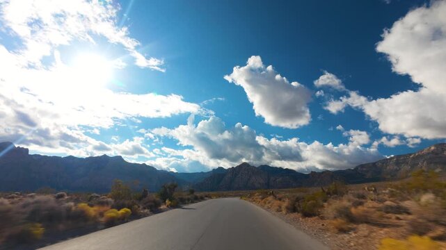 Red Rock Canyon Scenic Drive Loop POV 4K Sunny Day Dramatic Clouds Nevada