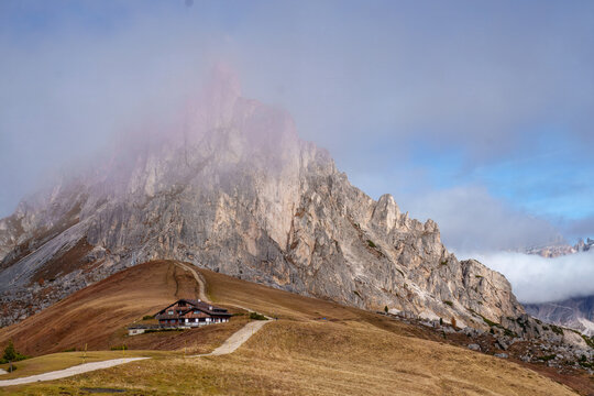 Mountain hut at Giau Pass (Passo Giau) under the Ra Gusela peak at sunrise, Dolomites, Italian Alps, South Tyrol, Italy.
