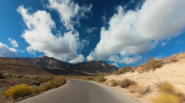 Red Rock Canyon Scenic Drive Loop POV 4K Sunny Day Dramatic Clouds Nevada
