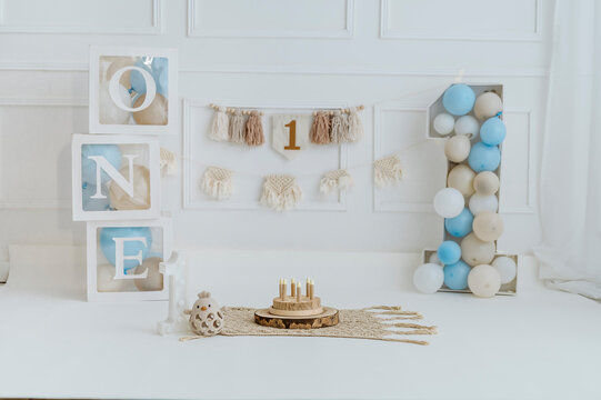 First birthday decoration with number one and neutral baby party setup