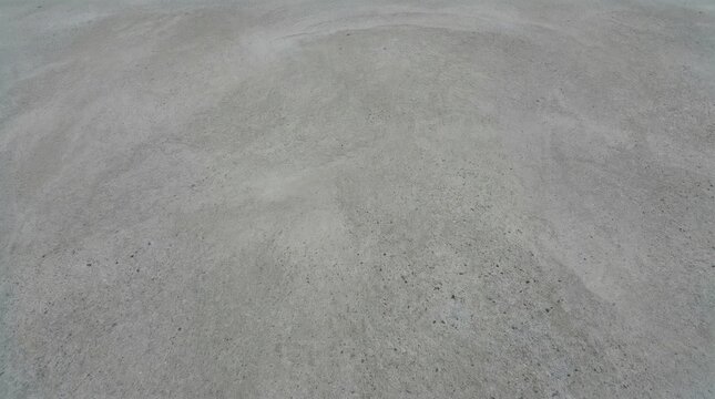 Rough gray concrete floor texture with industrial weathered surface background