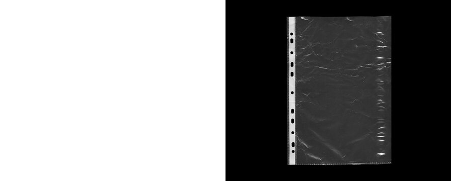 Clear plastic page protector with punched holes and textured surface.