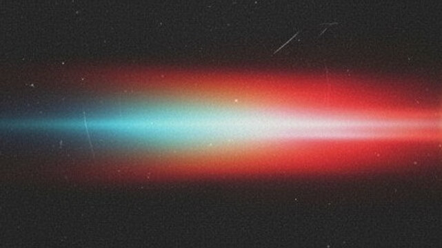 Abstract light leak overlay with a horizontal lens flare effect, featuring a vibrant gradient of blue and red colors against a dark, textured grainy background