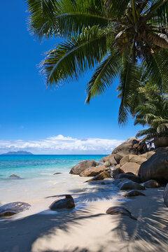 Tusculum Beach in Mah&eacute;, Seychelles, showcasing pristine white sand framed by striking granite boulders. Crystal-clear turquoise waters gently meet the shore