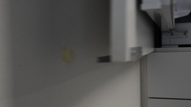 opening a white fridge door to a plastic stopper