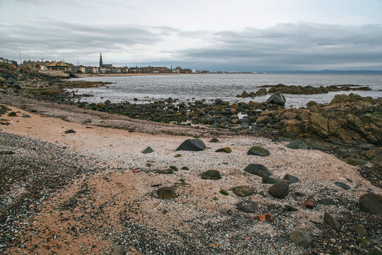 East end of Portobello beach in Edinburgh, overcast autumn day, Joppa parish church tower visible at distance