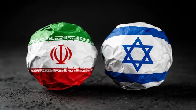 Two crumpled paper balls, each with a flag design against a dark backdrop