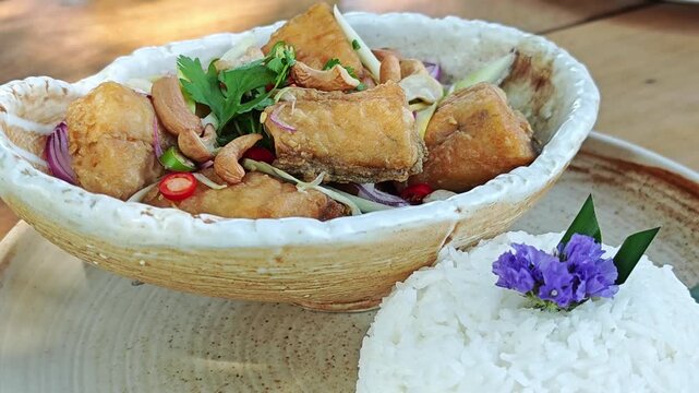 Deep Fried Sea Bass with Seasoning Fish Sauce and Green Mango Salad.