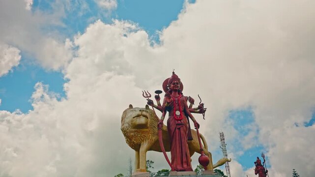 Grand bassin, also known as ganga talao, hindu temple and sacred lake in mauritius with durga maa statue on cloudy day