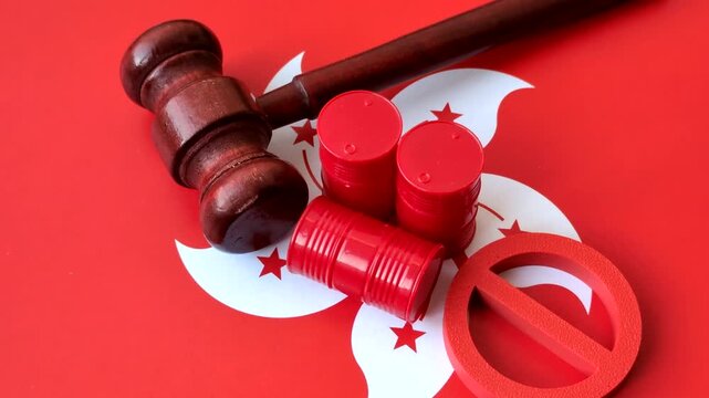 Metal barrels of oil, gas, or chemicals bearing on the flag of hong kong and a ban sign, embargo on production. Barrels of hong kong oil