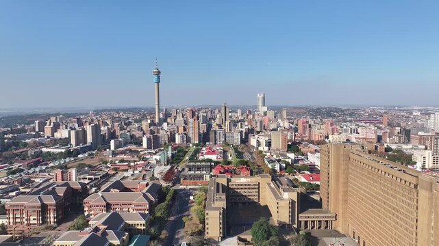 Dynamic aerial view of Pretoria skyline featuring iconic landmarks like Hillbrow Tower on a clear day