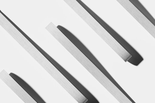 Minimalist geometric pattern with parallel textured gray bars and shadows