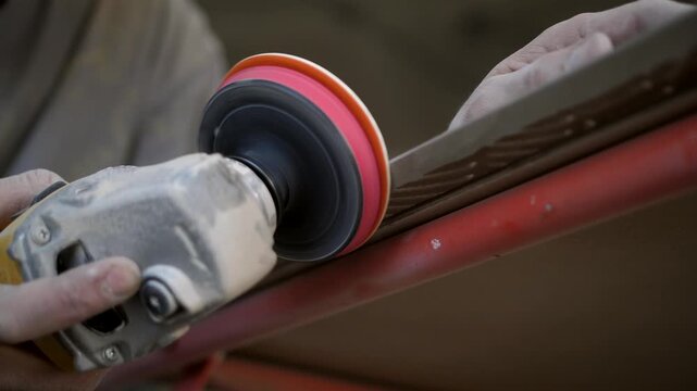 Worker Grinding Tile Edge for Precise Seam