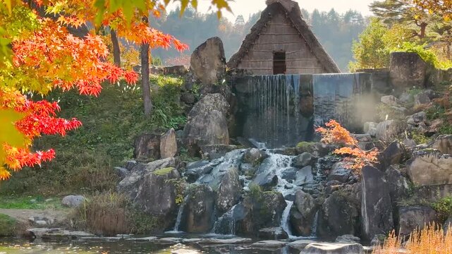 4K Cinematic Autumn in Shirakawa-go Village: Traditional House with Waterfall and Red Maple Leaves