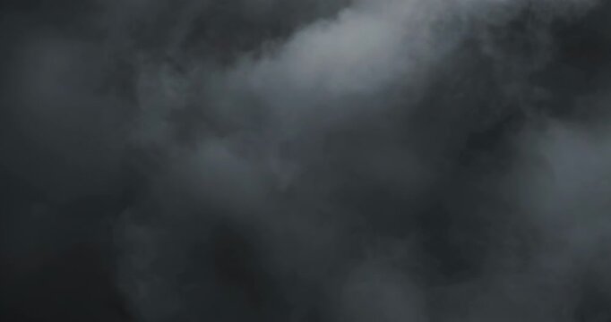 Smoke on black background. Premium cinematic fog and smoke VFX element featuring smooth, continuous motion and carefully balanced density that creates a believable and engaging atmospheric effect.