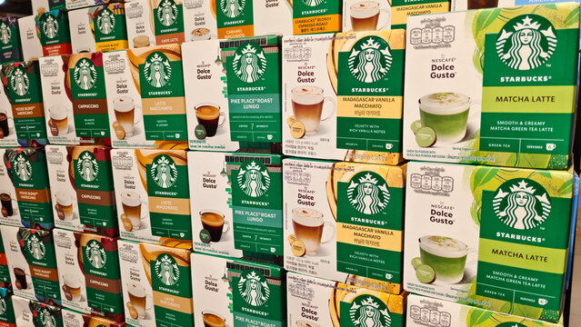 Variety of Starbucks Nescafe Dolce Gusto coffee capsules including Matcha Latte and Madagascar Vanilla Macchiato boxes on a supermarket retail shelf on September 19, 2025 in Bangkok, Thailand.