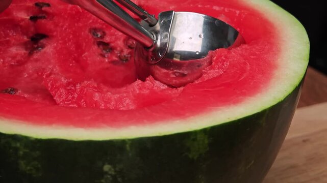 Watermelon fruit served with a scoop.