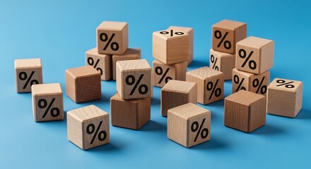 Fototapeta premium Wooden blocks with percentage symbols arranged on a blue surface