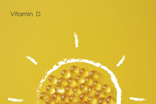 Vitamin D Capsules Arranged as Sun Shape, Natural Energy Concept