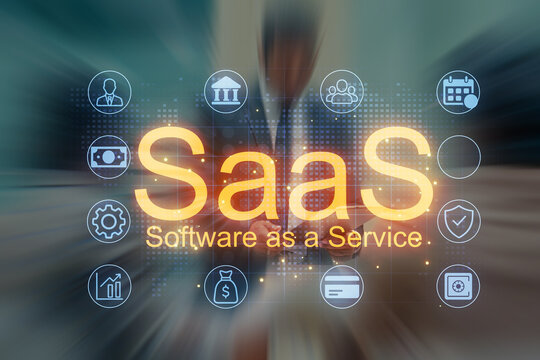 Software as a Service concept shown with icons and a user in a business setting during daytime