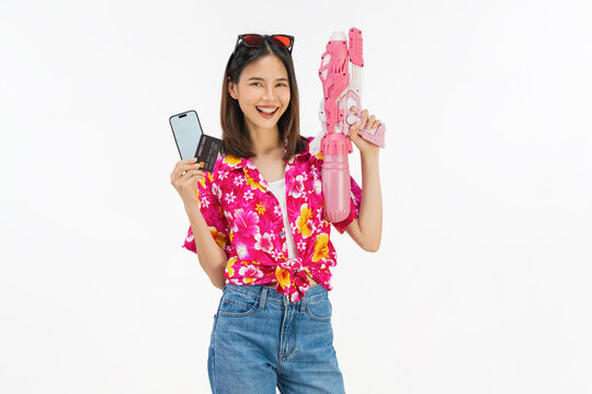 Young Asian woman in summer wearing floral shirt holding smartphone mockup of blank screen and credit card on white background.