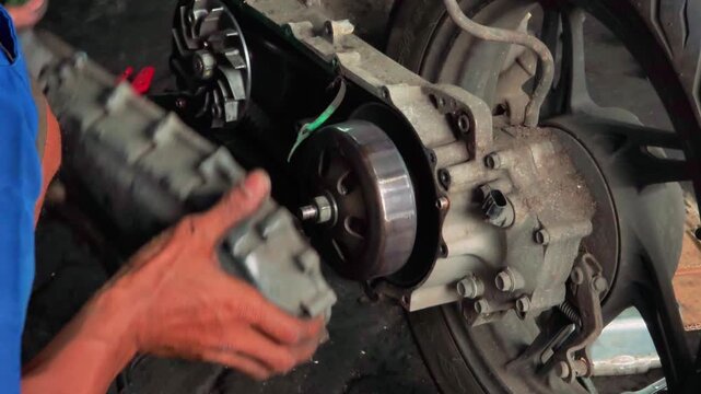 Professional motorcycle engine inspection and repair process with detailed mechanical work and focus on engine components and mechanics.