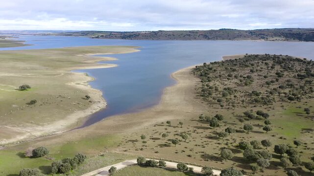 Aerial view of Santa Teresa Reservoir in Salamanca, Spain. Large freshwater reservoir on the Tormes River surrounded by agricultural plains and rolling hills, strategic water resource in Castilla y Le