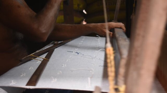 Indian Handloom Artisan Weaving Jamdani Fabric on Traditional Loom in Textile Workshop