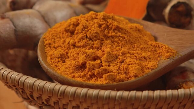 Turmeric powder on a spoon.