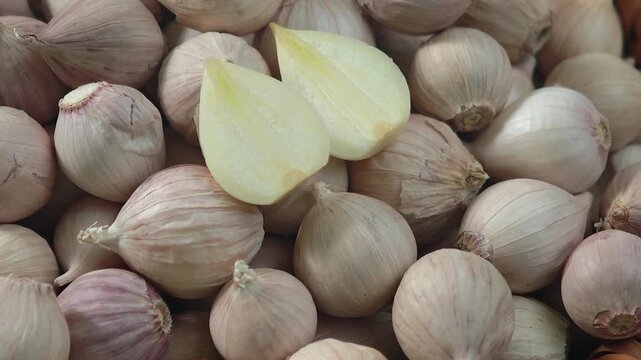 Single clove garlic in a wooden basket.garlic